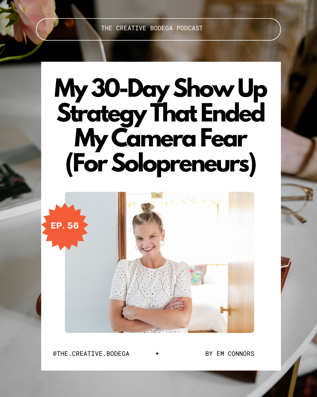 em smiling with arms crossed over chest