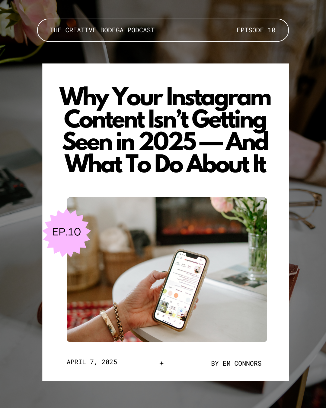 a hand with gold bracelets holding an iphone over a marble coffee table flowers in background